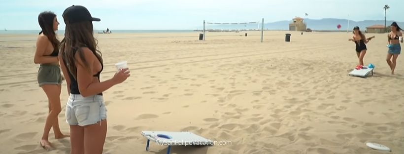 Playing cornhole game on the beach in San Felipe, Baja