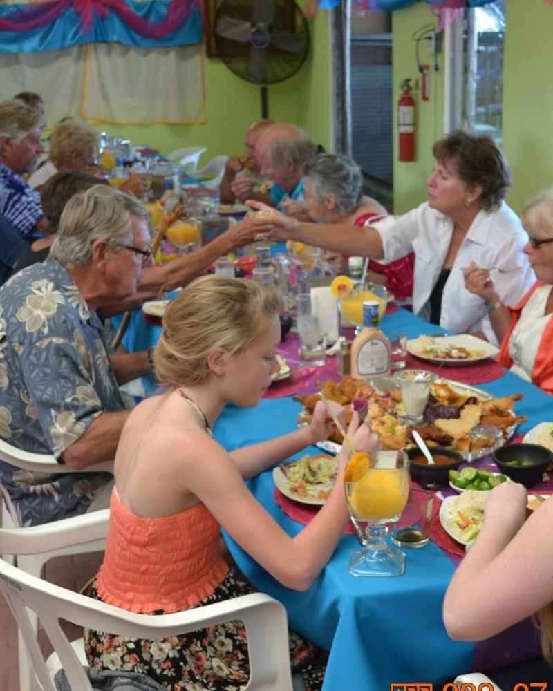 Friends laughing at a local restaurant
