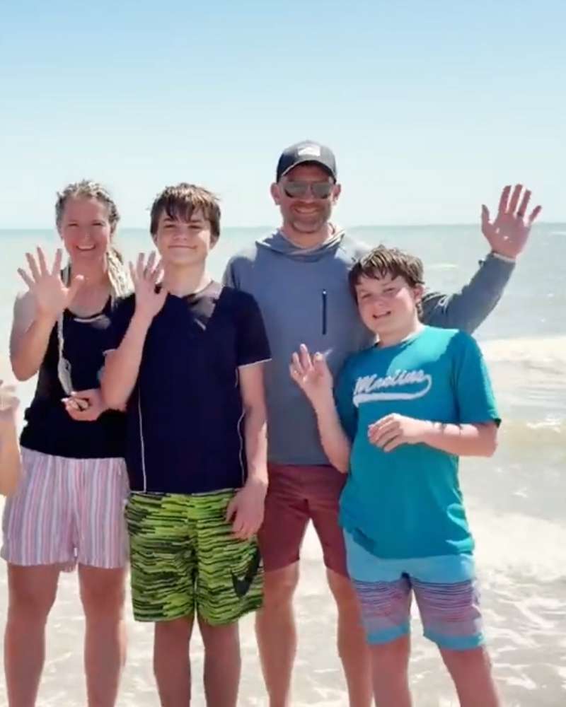 Family posing with the Sea of Cortez in the background
